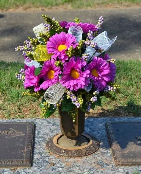 Monument with fresh flowers placed at its base